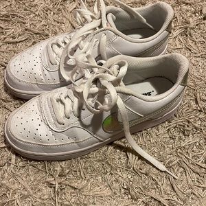 Nike white sneakers with silver swoosh